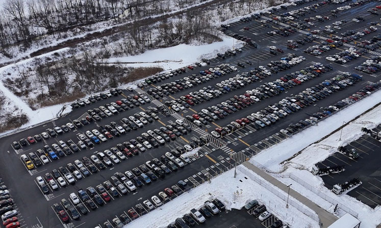 Wide shot of a parking lot cleared of snow