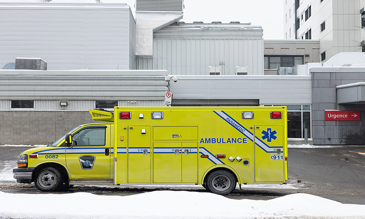 Ambulance pulling up to hospital in the snow