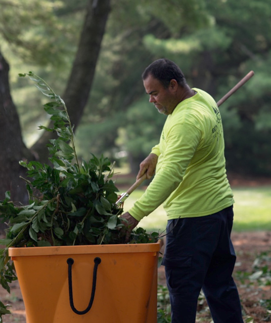 Worker cleaning up debris