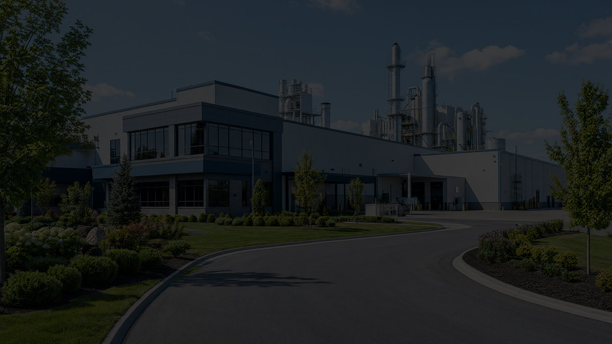 Exterior of an industrial plant entrance with professional landscaping